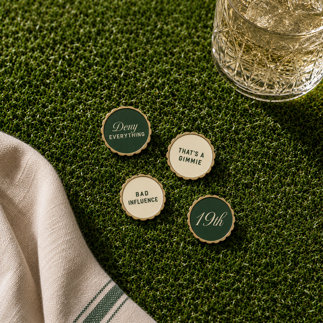 Ball marker set on green turf with crystal glass — Nineteenth Society Vol. 1