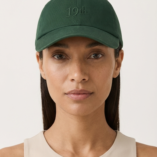 The Hat in heritage green worn by model — womens golf hat front view | Nineteenth Society